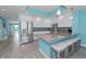 Modern kitchen featuring stainless steel appliances, granite countertops, and island seating at 19519 Gulf Blvd # 203, Indian Shores, FL 33785