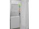 Laundry closet features a stacked washer and dryer unit, maximizing space at 19519 Gulf Blvd # 203, Indian Shores, FL 33785