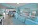 Inviting living room with white sofa, blue accents, and seamless flow to the adjacent kitchen area at 19519 Gulf Blvd # 203, Indian Shores, FL 33785