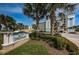Community signage showing the name Dolphin Key Condominiums in front of lush landscaping at 19519 Gulf Blvd # 203, Indian Shores, FL 33785