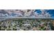 Wide angle aerial view of a waterfront community with winding canals and many beautiful clouds in the bright blue sky at 2186 Edythe Dr # 11, Dunedin, FL 34698