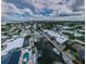 Expansive aerial view showcases the neighborhood, canals, and waterfront homes at 2186 Edythe Dr # 11, Dunedin, FL 34698