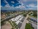 Waterfront homes offer canal access, carports and stunning open water views under a partly cloudy sky at 2186 Edythe Dr # 11, Dunedin, FL 34698