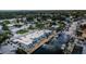 Aerial view of waterfront property featuring boat docks and a neighborhood canal system at 2186 Edythe Dr # 11, Dunedin, FL 34698