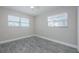 This bedroom is freshly painted, has laminate flooring, and a ceiling fan at 2186 Edythe Dr # 11, Dunedin, FL 34698