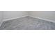 Spacious bedroom featuring stylish wood-look tile flooring and neutral wall paint at 2186 Edythe Dr # 11, Dunedin, FL 34698