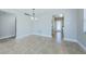 Dining room with tile flooring, chandelier, and views of the kitchen and outdoors at 2186 Edythe Dr # 11, Dunedin, FL 34698