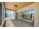 Screened lanai featuring neutral tile floors and sliding glass doors providing plenty of natural light at 2186 Edythe Dr # 11, Dunedin, FL 34698