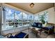 Relaxing lanai with comfortable seating and picturesque views of the canal and boats at 2186 Edythe Dr # 11, Dunedin, FL 34698