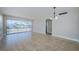 Bright living room with large sliding glass doors offering water views at 2186 Edythe Dr # 11, Dunedin, FL 34698