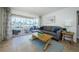 Comfortable living room features modern furnishings and a screened lanai with water views at 2186 Edythe Dr # 11, Dunedin, FL 34698