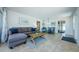 Spacious living room with a comfortable sofa, dining area, and tiled flooring throughout at 2186 Edythe Dr # 11, Dunedin, FL 34698