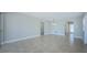The living room has tile floors, neutral paint, and plenty of space for relaxing and entertaining at 2186 Edythe Dr # 11, Dunedin, FL 34698