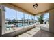 Relaxing screened-in patio with waterfront views of boats and docks at 2186 Edythe Dr # 11, Dunedin, FL 34698