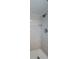 Updated bathroom features a shower with tiled walls, flooring, and shower head at 2186 Edythe Dr # 11, Dunedin, FL 34698