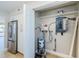 Utility closet with electrical panel, water heater, and additional storage space at 2186 Edythe Dr # 11, Dunedin, FL 34698