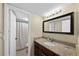 Bathroom boasts granite countertops and a large mirror at 2207 S Carolina Ave # 7, Tampa, FL 33629