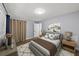 Comfortable bedroom with soft carpet, a queen bed, and two bedside tables at 2207 S Carolina Ave # 7, Tampa, FL 33629