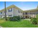 Beautiful exterior of home with lovely landscaping, trimmed hedges, and lush green grass at 2207 S Carolina Ave # 7, Tampa, FL 33629