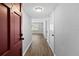Inviting hallway with hardwood floors and a glimpse of the living area at 2207 S Carolina Ave # 7, Tampa, FL 33629