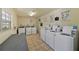 Clean and functional laundry room featuring multiple modern washing machines and dryers for residents' convenience at 2207 S Carolina Ave # 7, Tampa, FL 33629