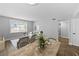 Open-concept living space combining dining and living area with hardwood floors and neutral decor at 2207 S Carolina Ave # 7, Tampa, FL 33629