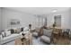 Open-concept living space combining dining and living area with hardwood floors and neutral decor at 2207 S Carolina Ave # 7, Tampa, FL 33629