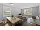 Bright living and dining area showcasing contemporary furnishings, natural light, and stylish decor at 2207 S Carolina Ave # 7, Tampa, FL 33629
