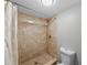 The shower features patterned tile and a glass shower door at 2207 S Carolina Ave # 7, Tampa, FL 33629