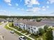Aerial view of townhomes with manicured landscaping and ample parking at 2432 Hearth Dr, Odessa, FL 33556