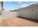 Private backyard featuring a brick patio and a white privacy fence at 2432 Hearth Dr, Odessa, FL 33556