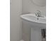 Close up of a bathroom with white pedestal sink and chrome faucet at 2432 Hearth Dr, Odessa, FL 33556