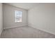 Bedroom featuring carpet and natural light from a window at 2432 Hearth Dr, Odessa, FL 33556