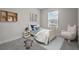 Bright bedroom with a cozy bed, soft rug, and playful decor, perfect for a sanctuary and relaxation at 2432 Hearth Dr, Odessa, FL 33556