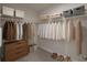 Organized walk-in closet providing generous storage space with shelving and hanging rods at 2432 Hearth Dr, Odessa, FL 33556