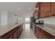 Modern kitchen with stainless steel appliances and granite countertops at 2432 Hearth Dr, Odessa, FL 33556