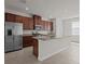 Stylish kitchen with stainless appliances and granite countertops at 2432 Hearth Dr, Odessa, FL 33556