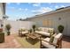 Inviting outdoor patio space with comfortable seating and a charming brick floor, ideal for relaxing and entertaining at 2432 Hearth Dr, Odessa, FL 33556