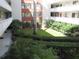 Courtyard featuring a lush, green, and well-maintained landscape nestled within the condominium complex at 2630 Pearce Dr # 208, Clearwater, FL 33764