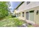The backyard features a well-maintained lawn and a cozy outdoor seating area at 2746 Birchcreek Dr, Wesley Chapel, FL 33544