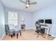 Bedroom with a ceiling fan, a large window, and comfortable furniture at 2746 Birchcreek Dr, Wesley Chapel, FL 33544