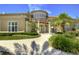 Elegant clubhouse exterior with manicured landscaping and stately entrance at 2746 Birchcreek Dr, Wesley Chapel, FL 33544