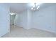 A traditional dining room space with bright lighting and adjacent entryway at 2746 Birchcreek Dr, Wesley Chapel, FL 33544