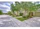 Street view of attractive townhomes with mature trees and manicured lawns at 2746 Birchcreek Dr, Wesley Chapel, FL 33544