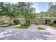 Well-maintained townhomes with lush landscaping and individual garages at 2746 Birchcreek Dr, Wesley Chapel, FL 33544
