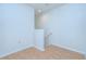Bright hallway with hardwood floors leads to stairs at 2746 Birchcreek Dr, Wesley Chapel, FL 33544