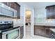 Well-equipped kitchen with stainless steel appliances, granite countertops, and a convenient pantry at 2746 Birchcreek Dr, Wesley Chapel, FL 33544