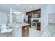 A kitchen featuring a center island with seating and stainless steel appliances at 2746 Birchcreek Dr, Wesley Chapel, FL 33544