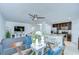 Spacious living area featuring kitchen and dining space with modern decor and stainless appliances at 2746 Birchcreek Dr, Wesley Chapel, FL 33544