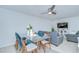 Open concept living area with dining space, ceiling fan, and comfortable seating at 2746 Birchcreek Dr, Wesley Chapel, FL 33544